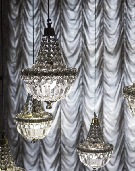 Crystal chandeliers on the background of curtains